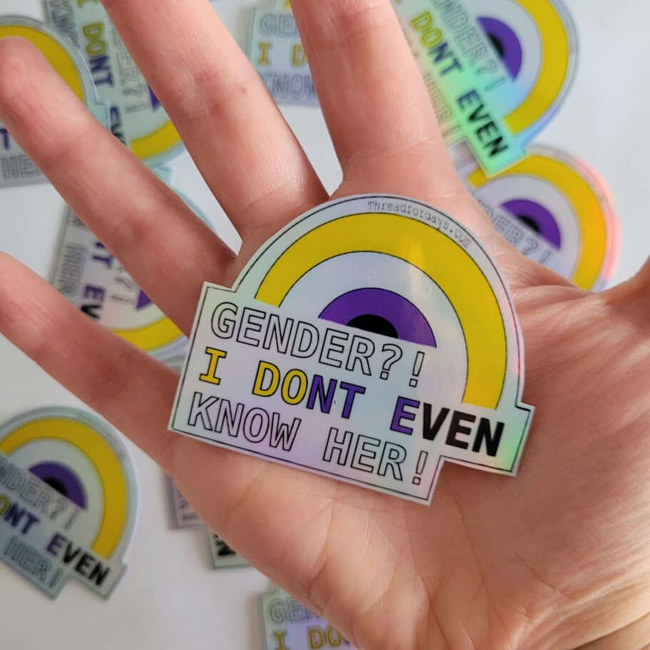 Gender I dont even know her sticker held in palm