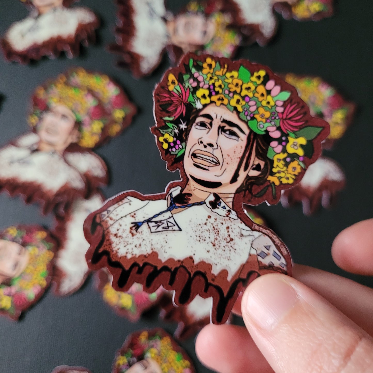midsommar sticker held in fingers