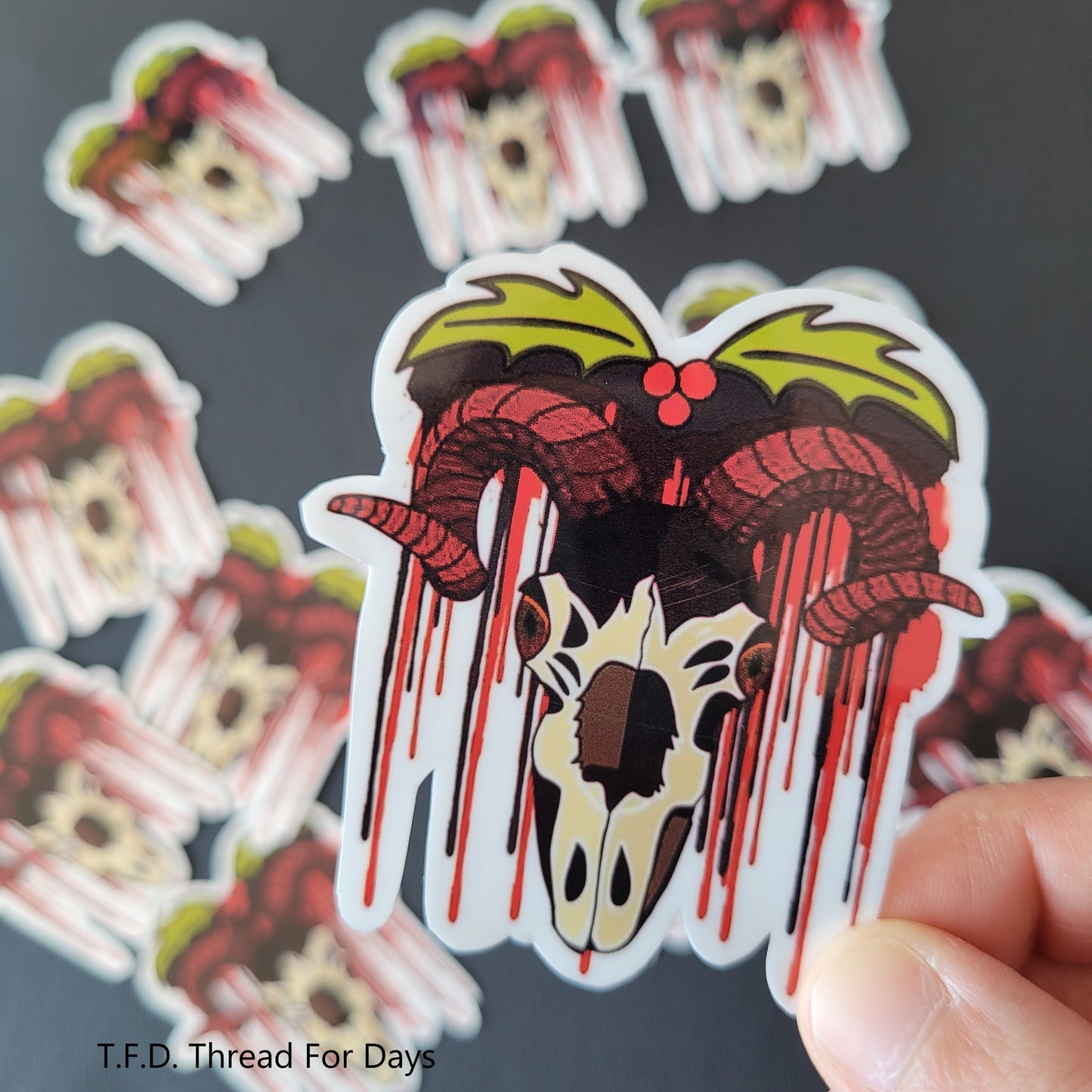 close up krampus sticker held in fingers
