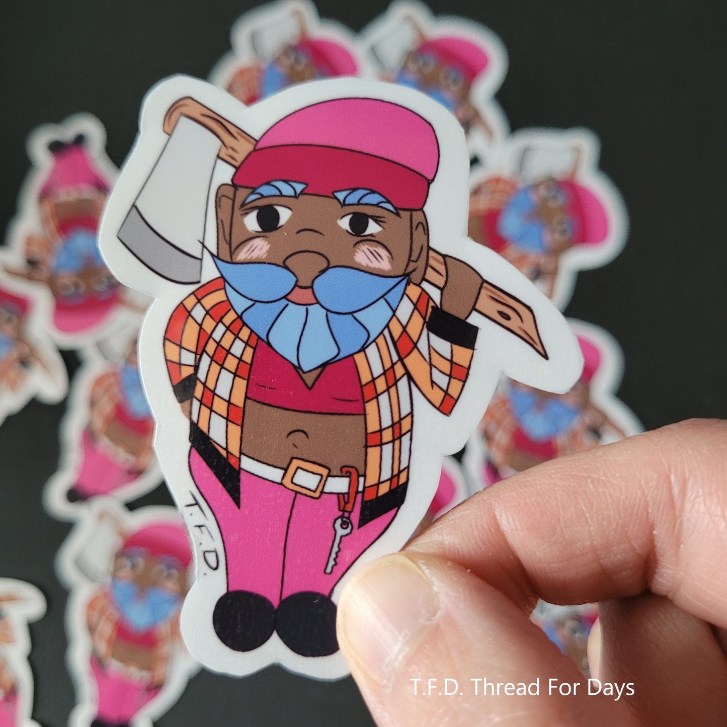 lesbian gnome sticker held between fingers