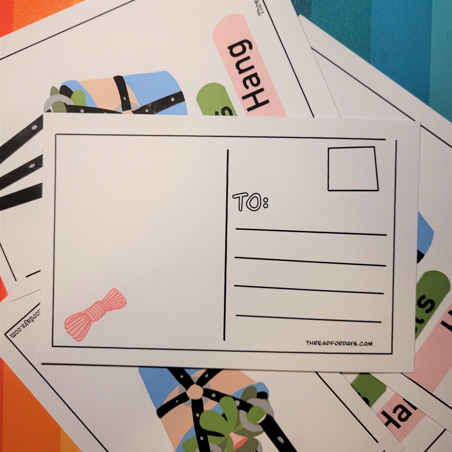 back of lets hand postcard with shibari rope doodle