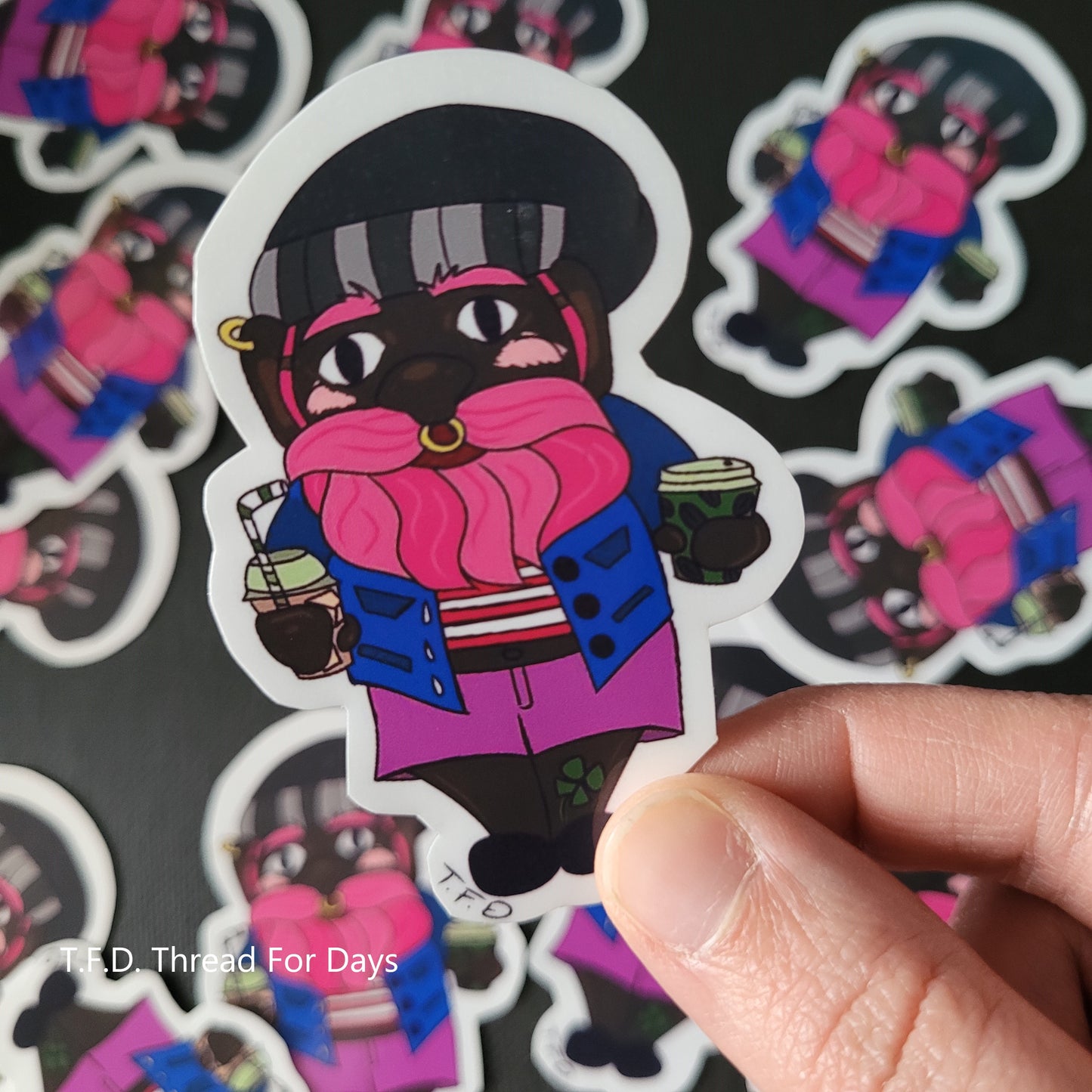 bisexual gnome sticker held between hands