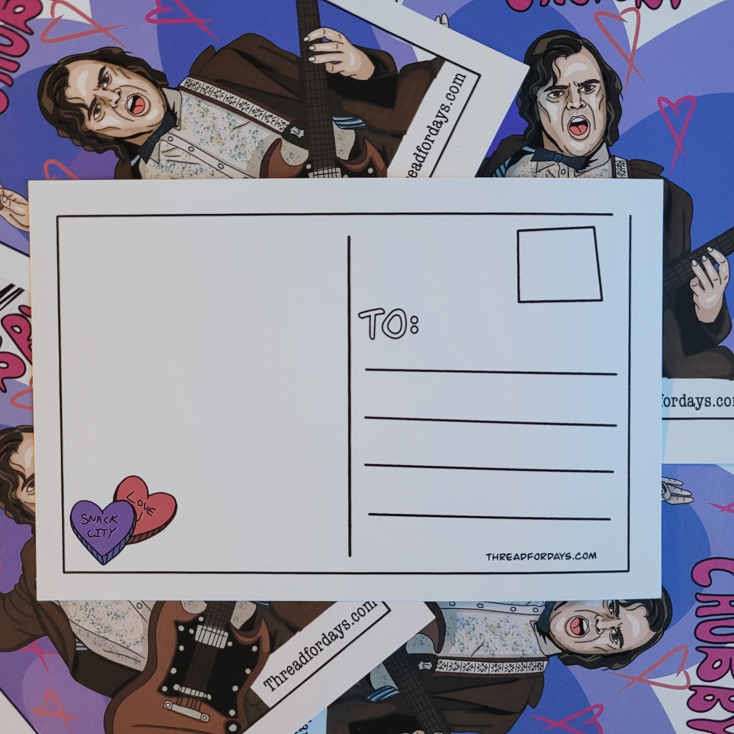 back of sexy and chubby postcard with two doodled hearts with the text "snack city"