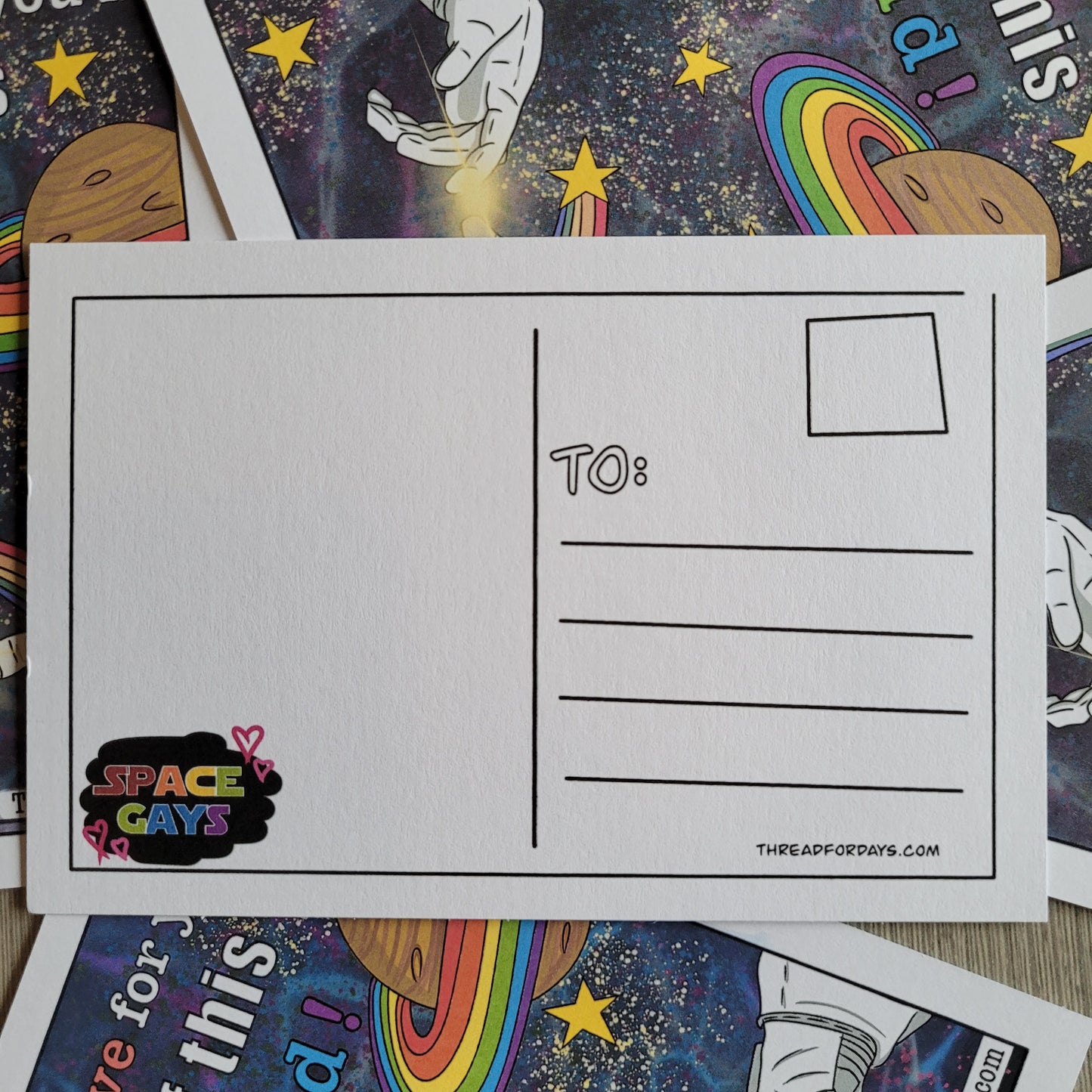 back of space gays postcard with a doodled bubble with the text "space gays"