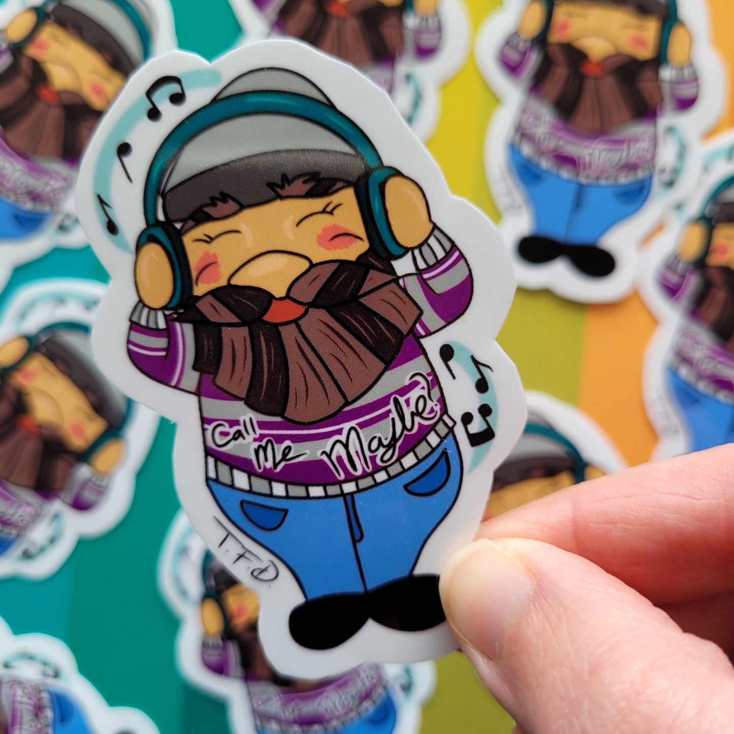 greysexual gnome held between fingers