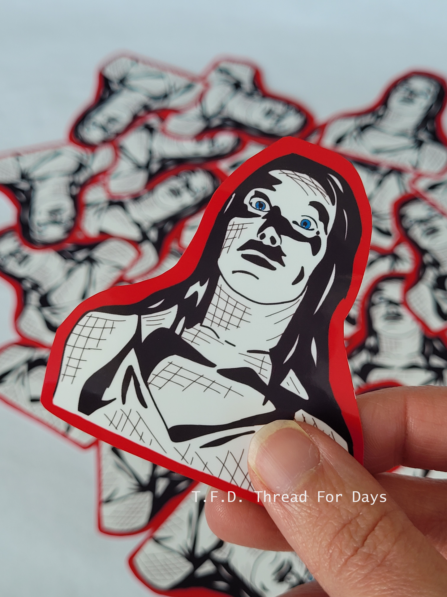 carrie sticker held in hand