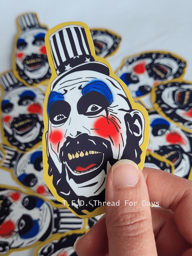 hand holding captain spalding sticker