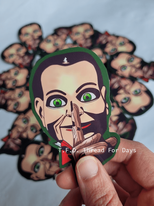 Billy the doll vinyl sticker in hand