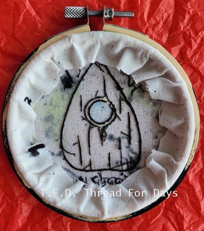 back of ouija planchette embroidery hoop