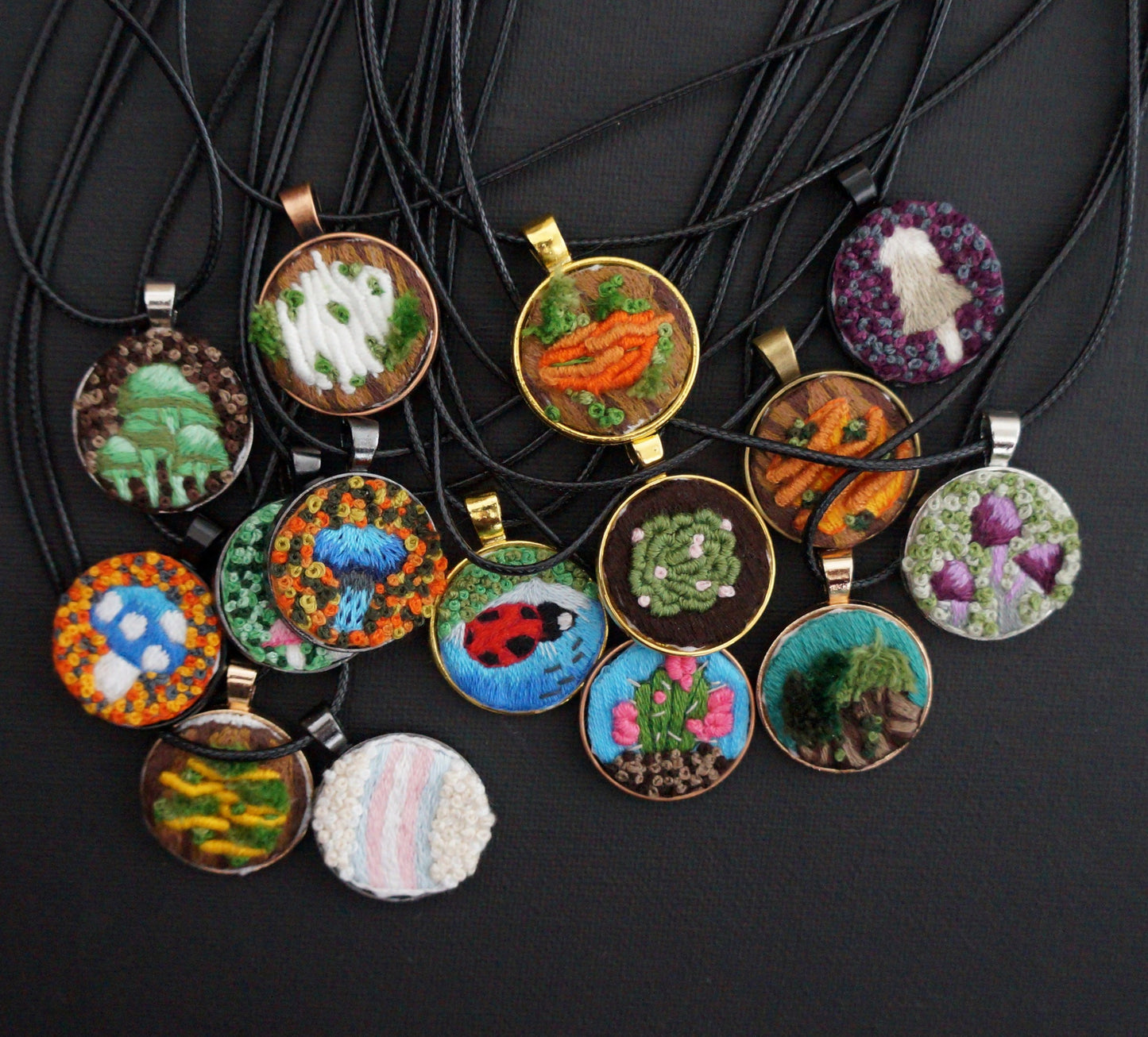 many embroidered pendants
