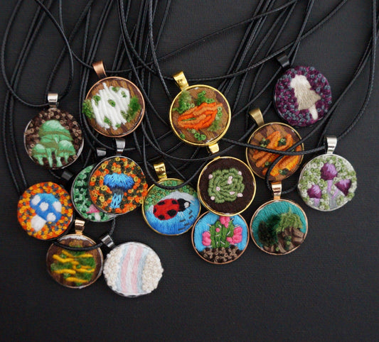 many embroidered pendants