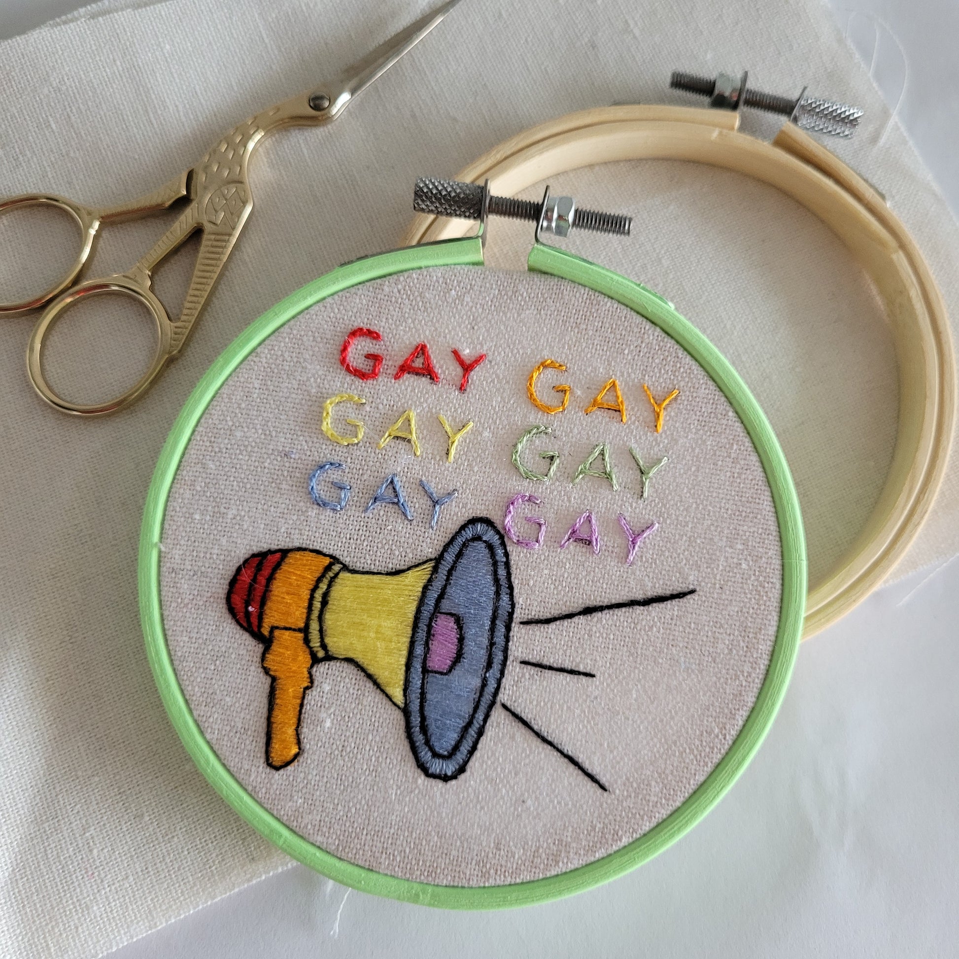 GAY GAY GAY GAY GAY GAY with a rainbow megaphone