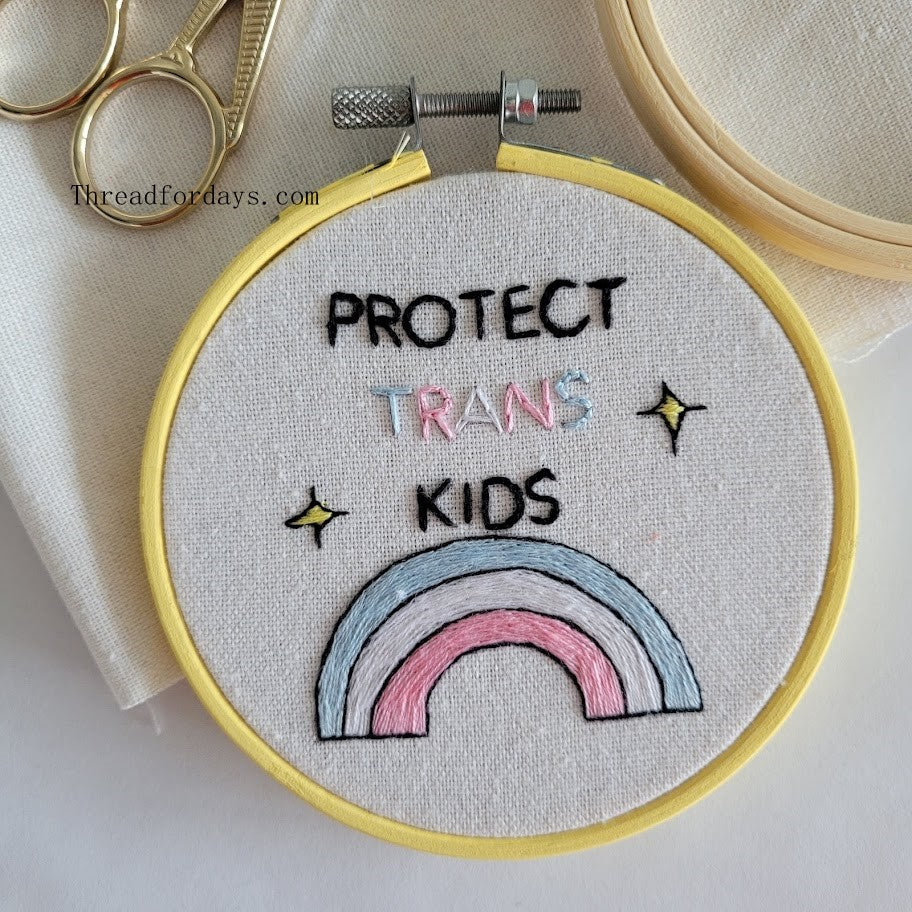 close up of the protect trans kids hoop