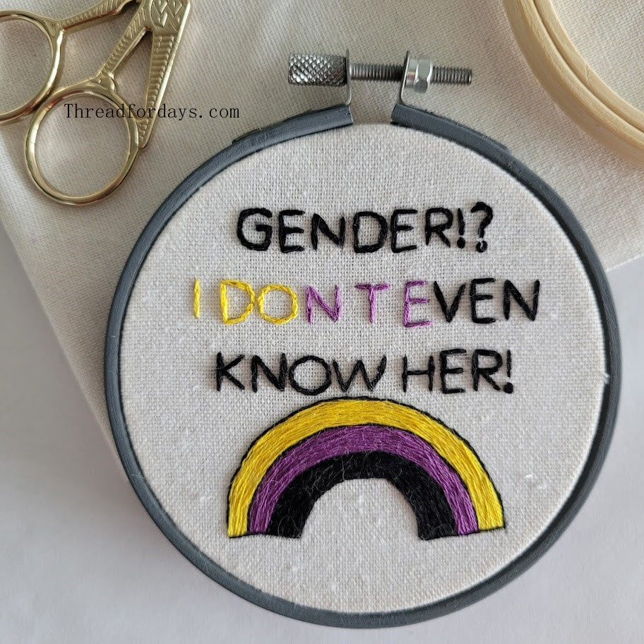 close up of gender i dont even know her hoop with scissors