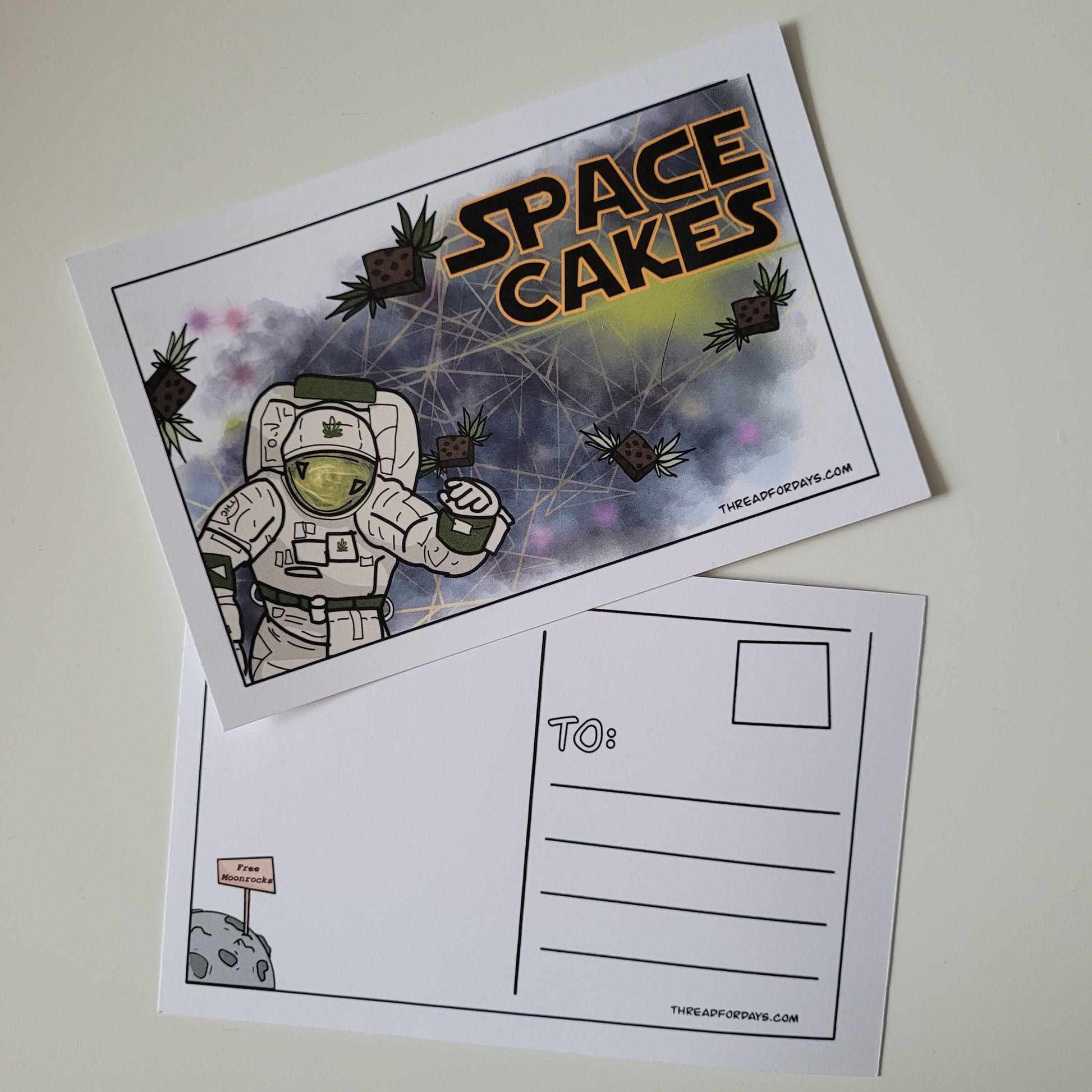 front and back of space cakes postcard