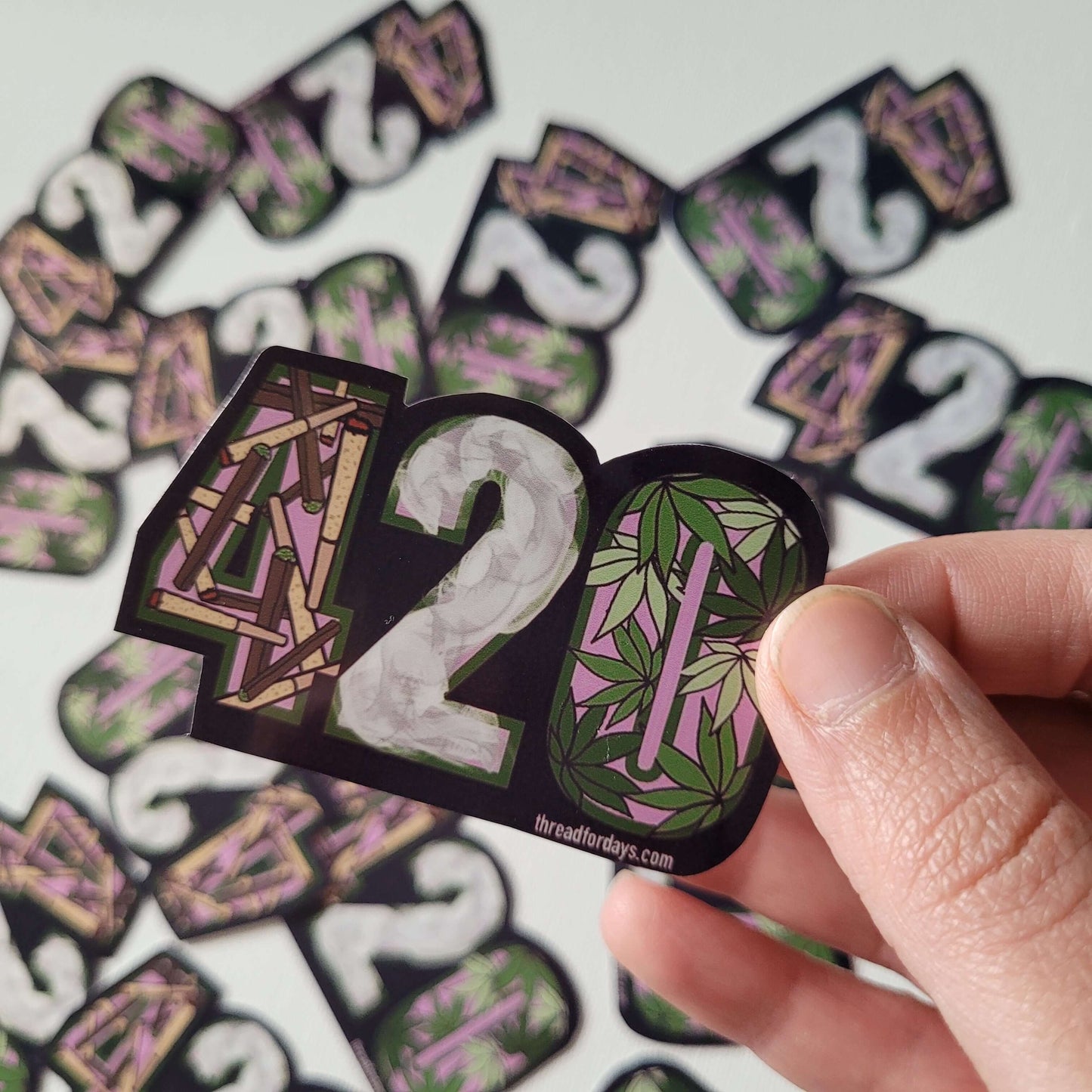 420 sticker held in hand