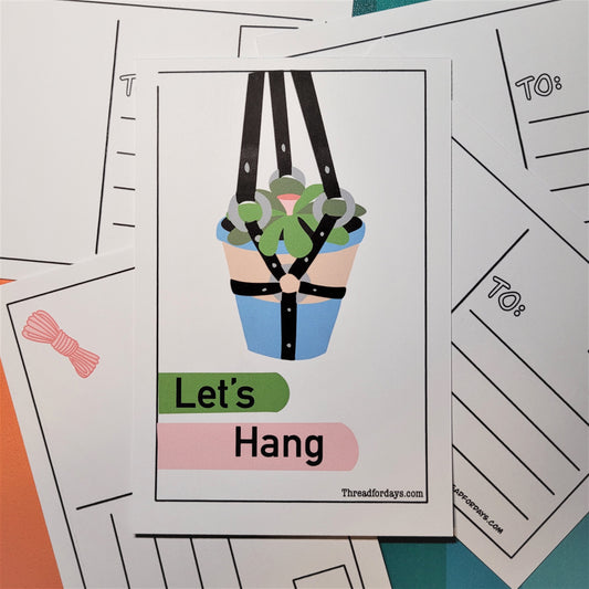 lets hang postcard front with a succulent in a terracotta pot hanging in a BDSM harness. text reads "let's Hang"
