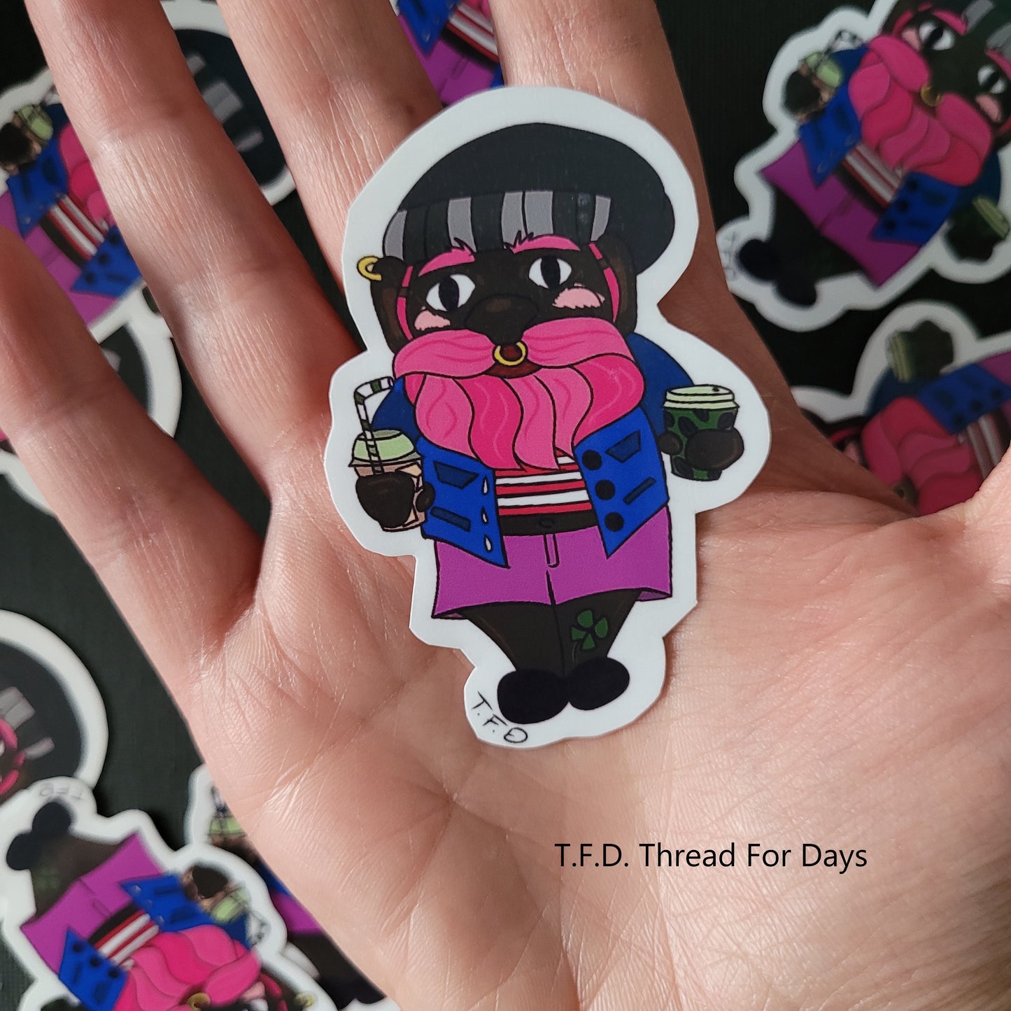 bisexual gnome sticker held in palm to indicate size