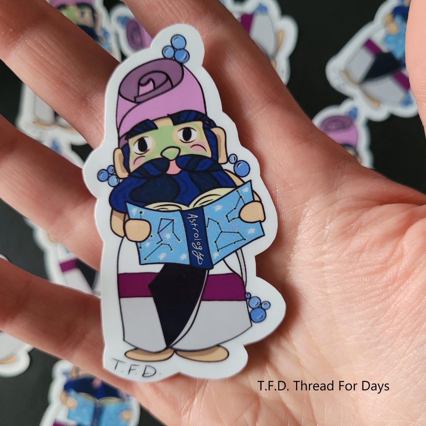 demisexual gnome sticker held in palm of hand for size reference