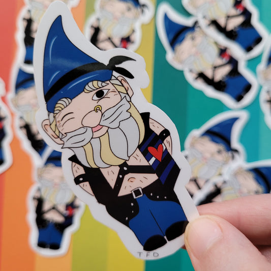 leather daddy gnome sticker held between fingers