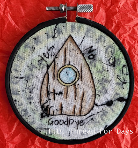 front of ouija planchette embroidery hoop