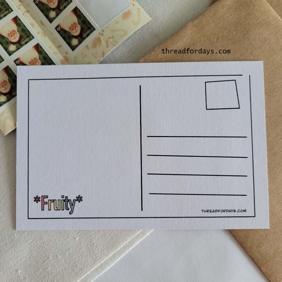 back of fruity postcard on a table